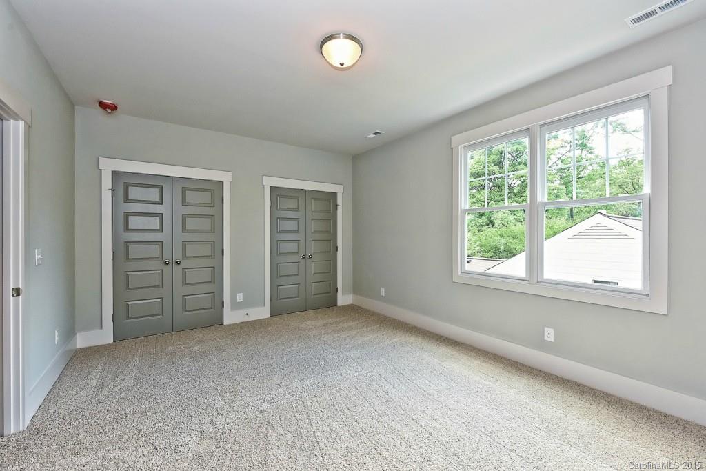 913 Sedgefield Road Charlotte, NC 28209 - Photo 16 of 24 an empty room with windows and closet
