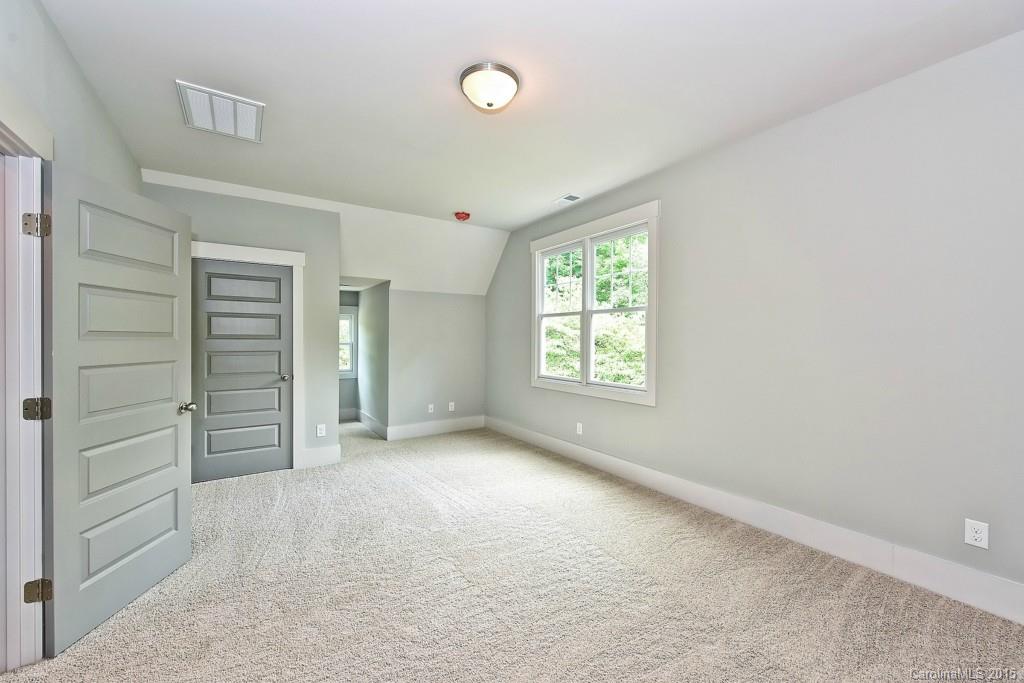 913 Sedgefield Road Charlotte, NC 28209 - Photo 18 of 24 an empty room with a window and closet