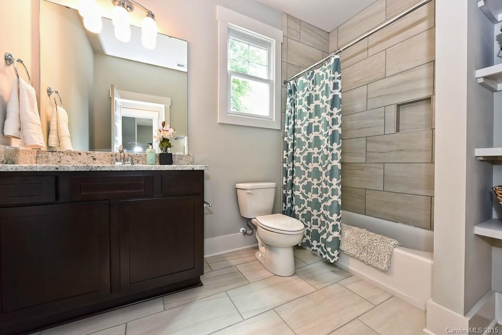 913 Sedgefield Road Charlotte, NC 28209 - Photo 20 of 24 a bathroom with a sink a toilet and shower