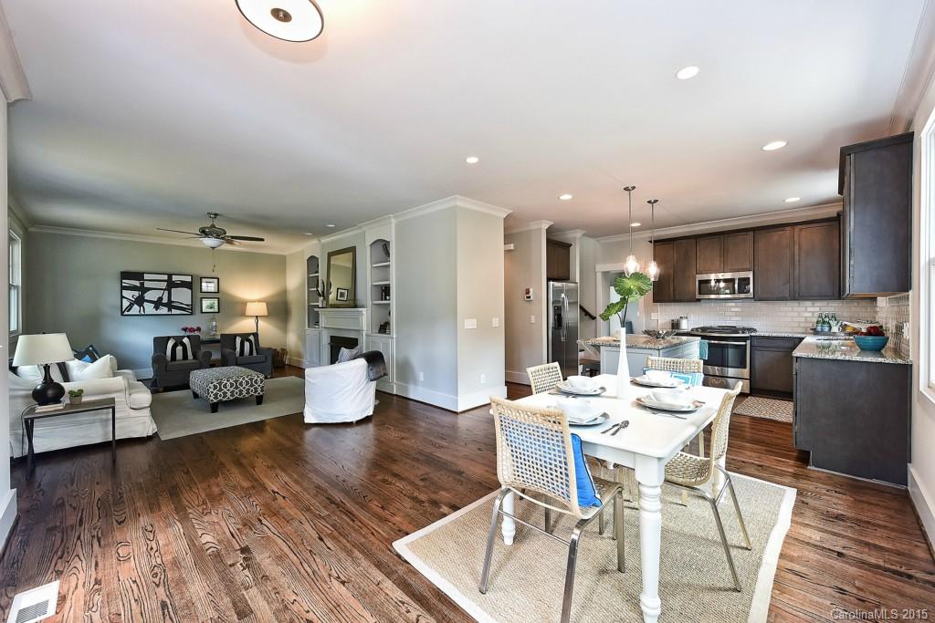 913 Sedgefield Road Charlotte, NC 28209 - Photo 3 of 24 a kitchen with a dining table chairs and view living room