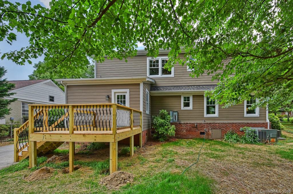 913 Sedgefield Road Charlotte, NC 28209 - Photo 22 of 24 a front view of a house with a garden and deck