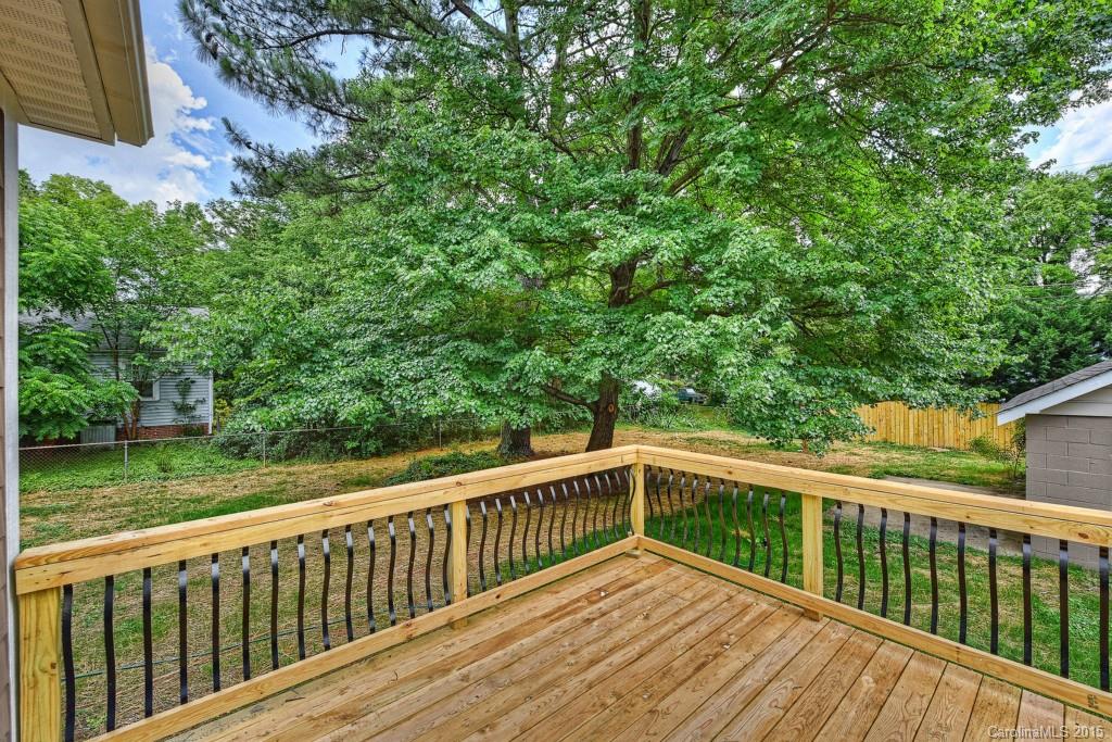 913 Sedgefield Road Charlotte, NC 28209 - Photo 23 of 24 a view of a wooden deck next to a yard