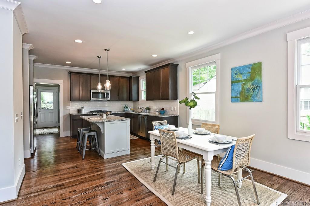 913 Sedgefield Road Charlotte, NC 28209 - Photo 4 of 24 a kitchen with a table and chairs in it