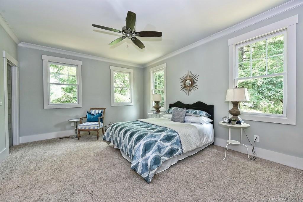 913 Sedgefield Road Charlotte, NC 28209 - Photo 10 of 24 a bed room with a bed and a window