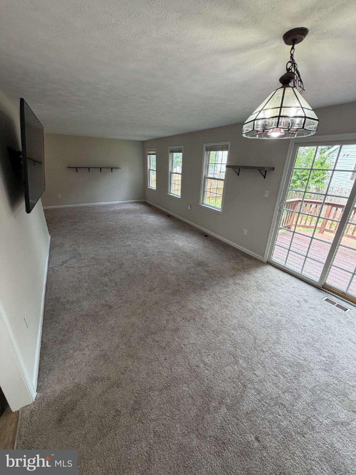 313 3rd Street Colonial Beach, VA 22443 - Photo 5 of 36 Spacious room with natural light.