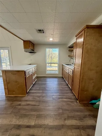 a view of a kitchen from the hallway