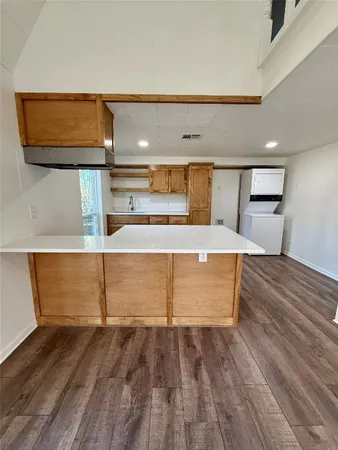 a view of kitchen and wooden floor