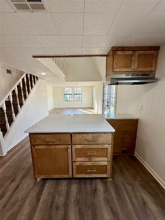 a living room with a wooden floor