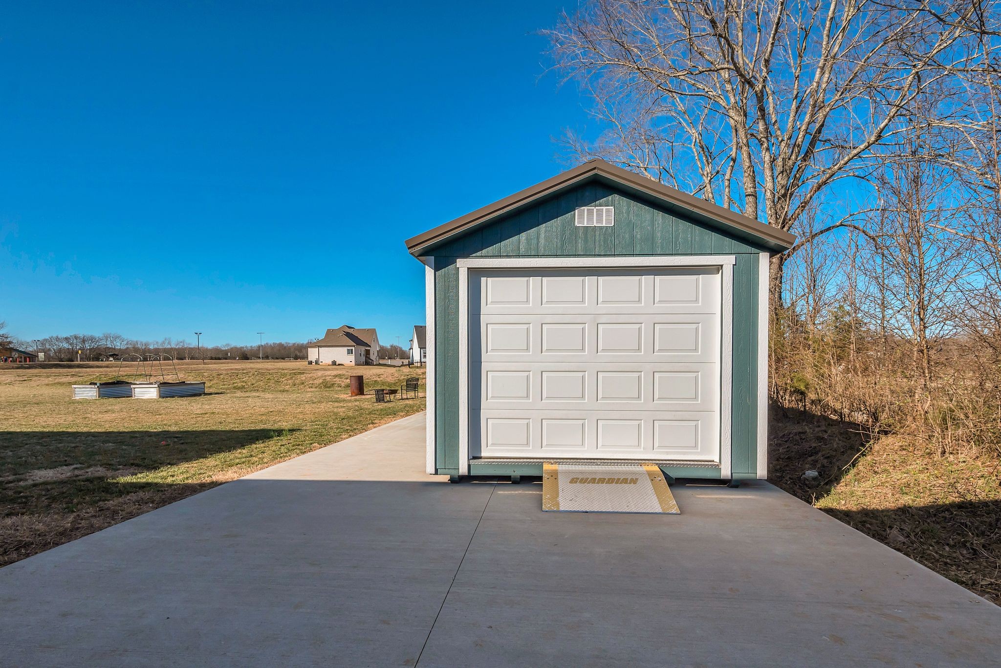 2507 Pleasant View Road Pleasant View, TN 37146 - Photo 32 of 38 a view of a house with a yard and garage