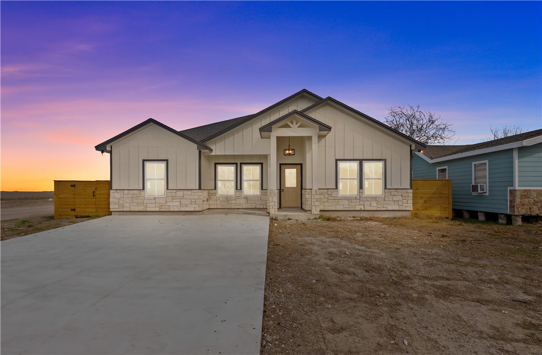 947 Mesquite Street Robstown, TX 78380 - Photo 1 of 16 a front view of a house with a yard