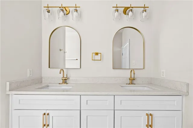 a bathroom with a double vanity sink and a
