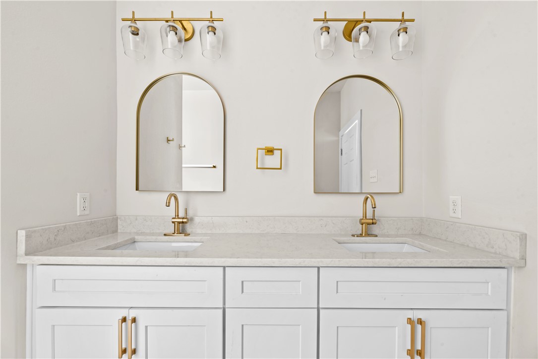 947 Mesquite Street Robstown, TX 78380 - Photo 11 of 16 a bathroom with a double vanity sink and a