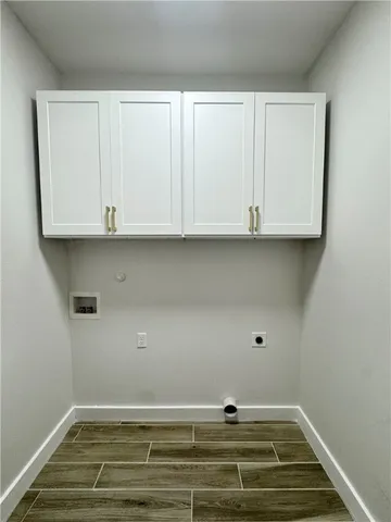 a view of room with granite countertop cabinets