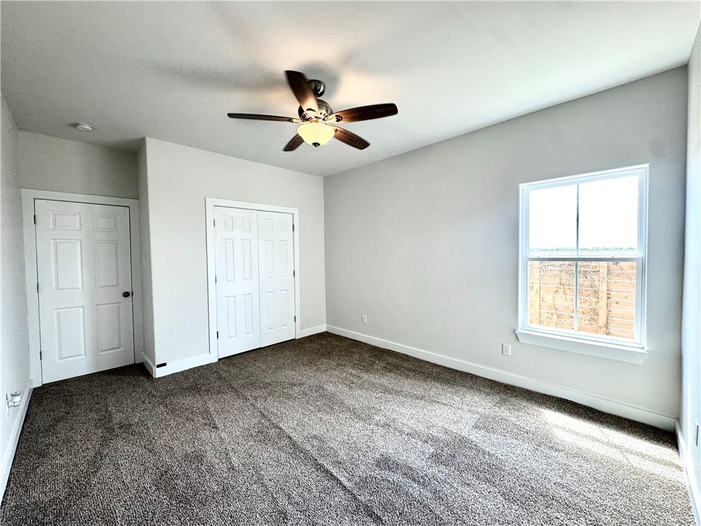 947 Mesquite Street Robstown, TX 78380 - Photo 8 of 16 a view of an empty room with a window