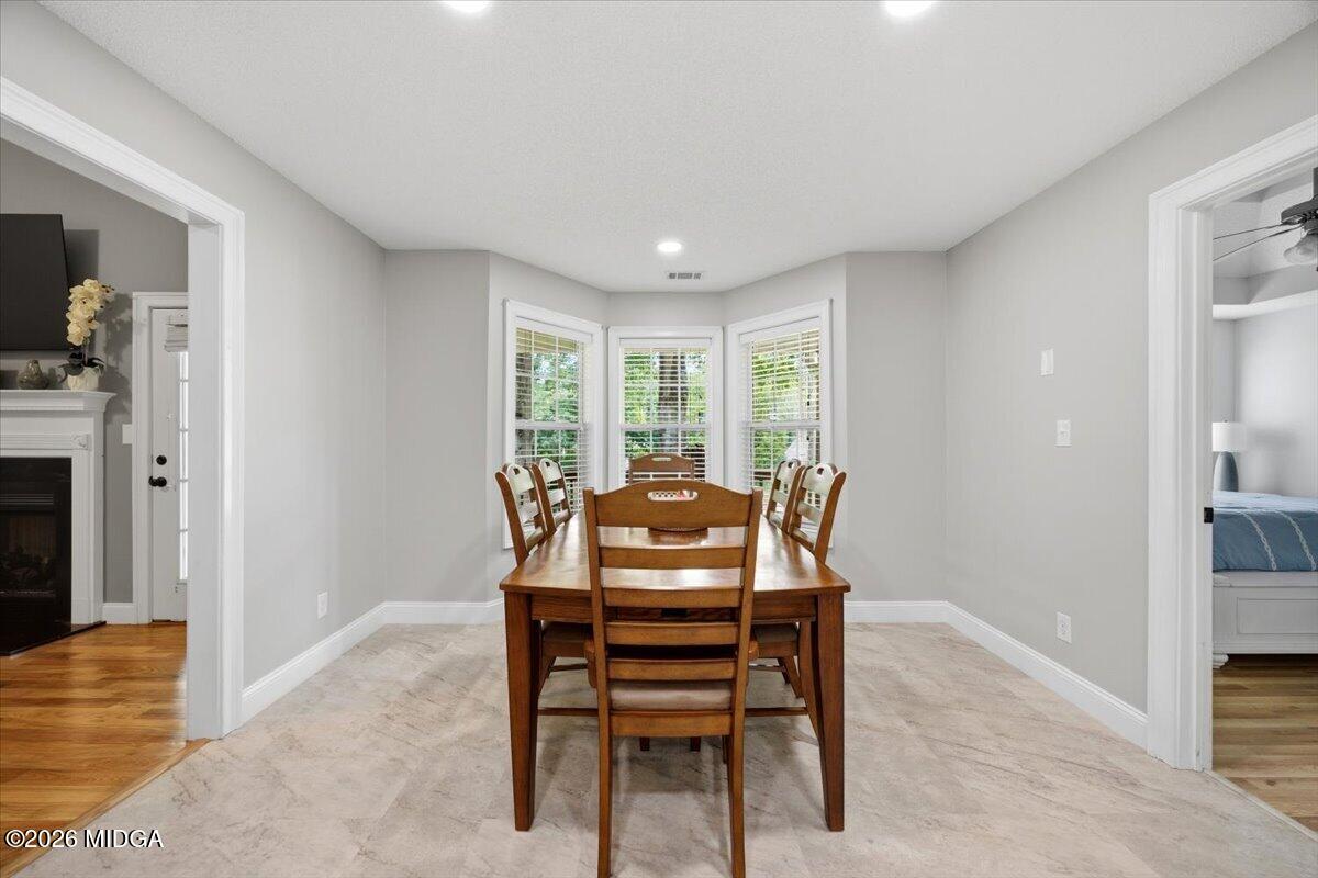557 Aarons Circle Gray, GA 31032 - Photo 14 of 36 a dining room with furniture and window