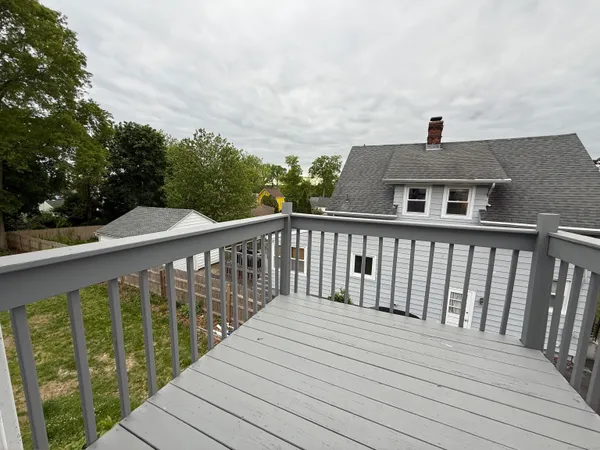 a view of a wooden deck and city view