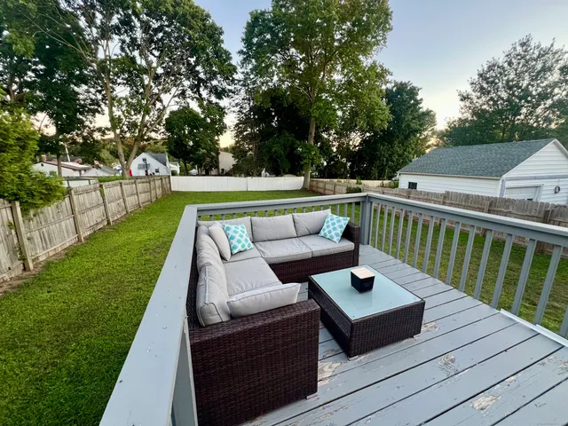a view of sitting area with furniture in a yard