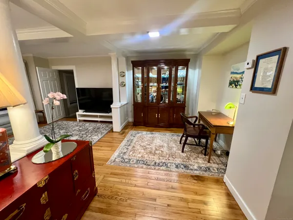 a living room with furniture and a rug