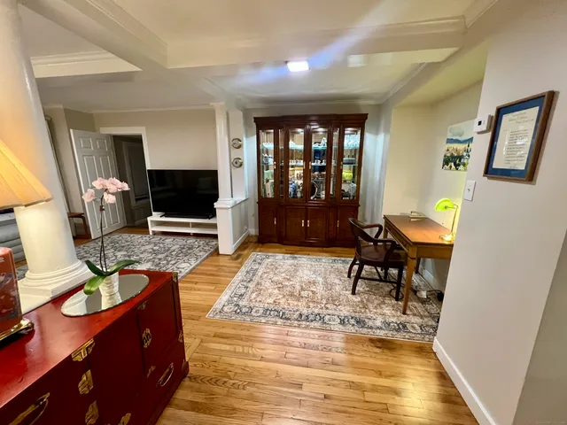 a living room with furniture and a rug