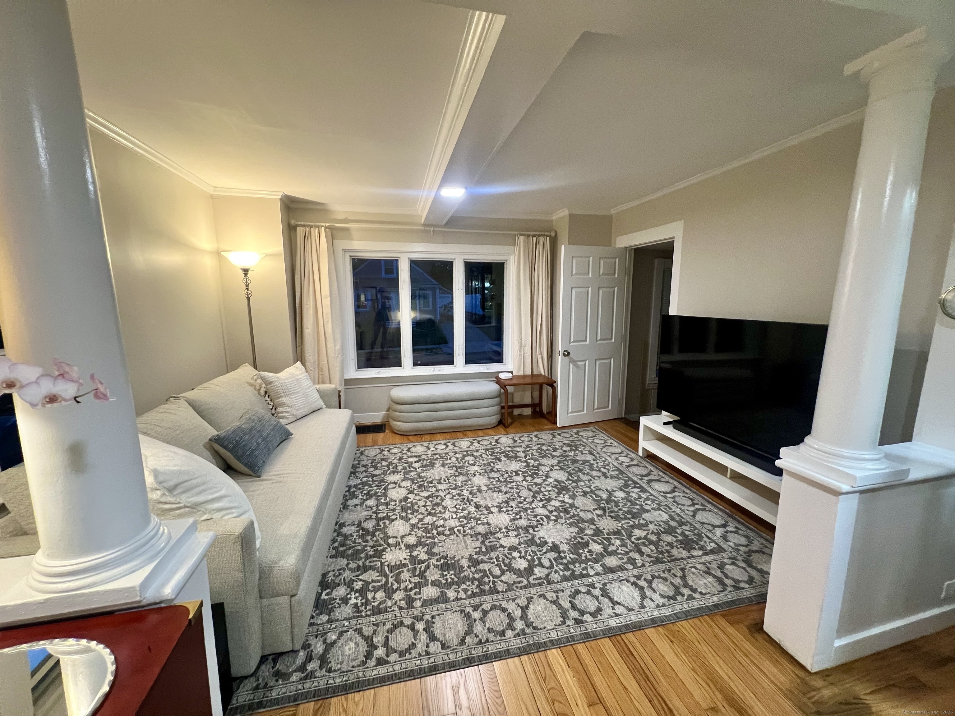 111 Fort Hale Road New Haven, CT 06512 - Photo 5 of 21 a living room with a couch and a flat screen tv