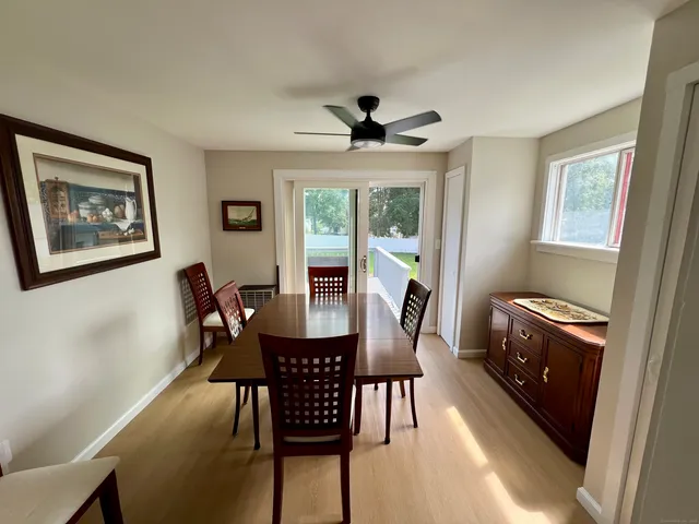 a dining room with furniture and window