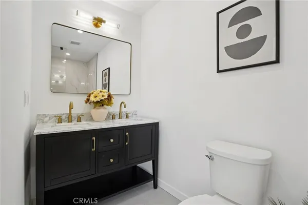 a bathroom with a tub shower and sink