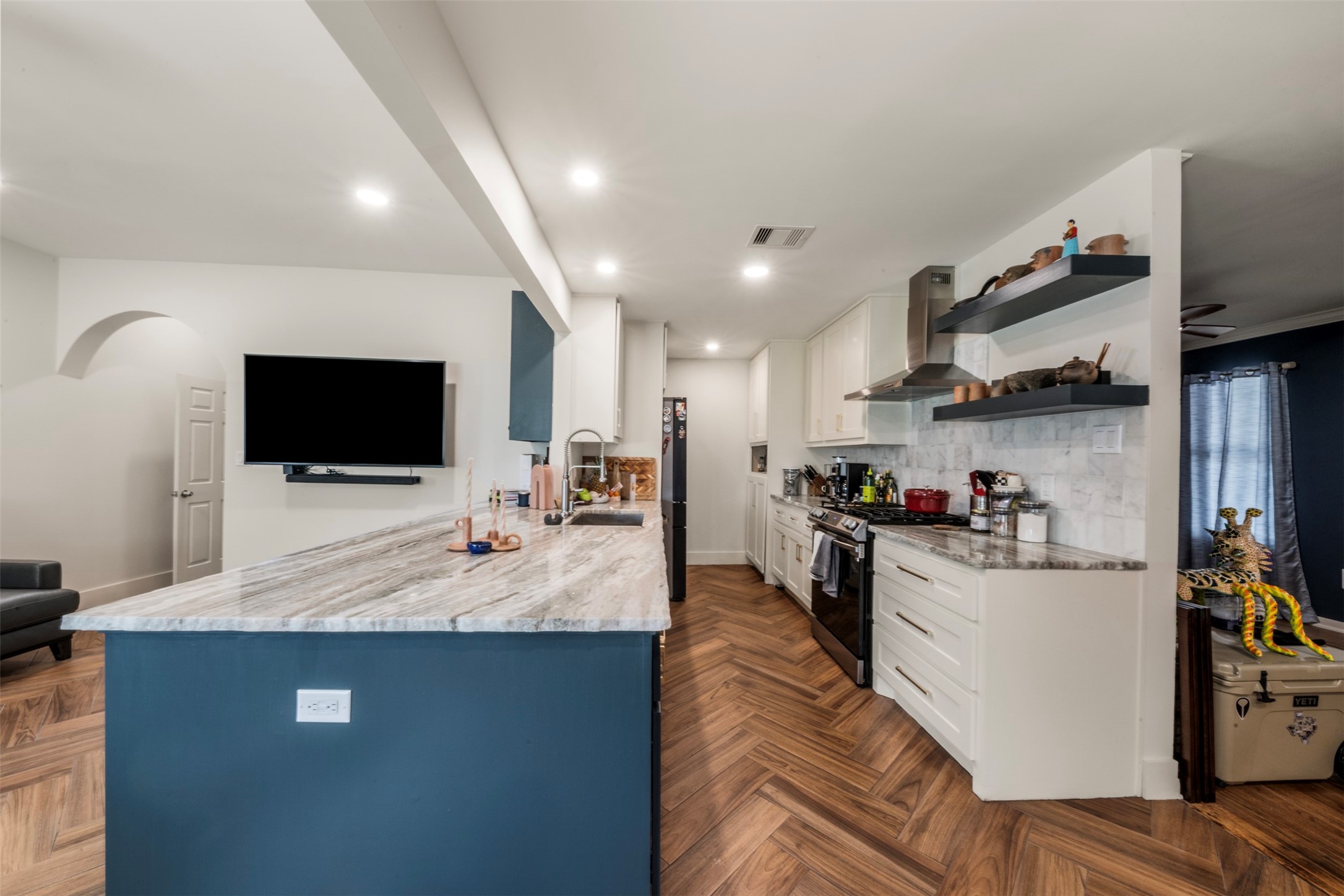 1913 Thonig Road Houston, TX 77055 - Photo 12 of 36 a view of living room kitchen with stainless steel appliances cabinets