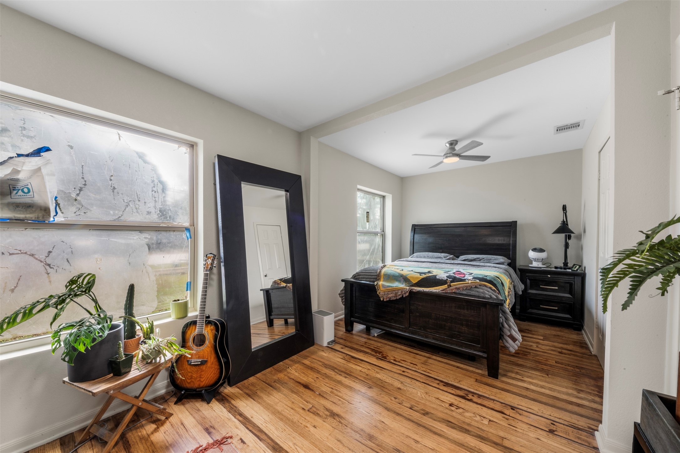 1913 Thonig Road Houston, TX 77055 - Photo 16 of 36 a bedroom with furniture and a window