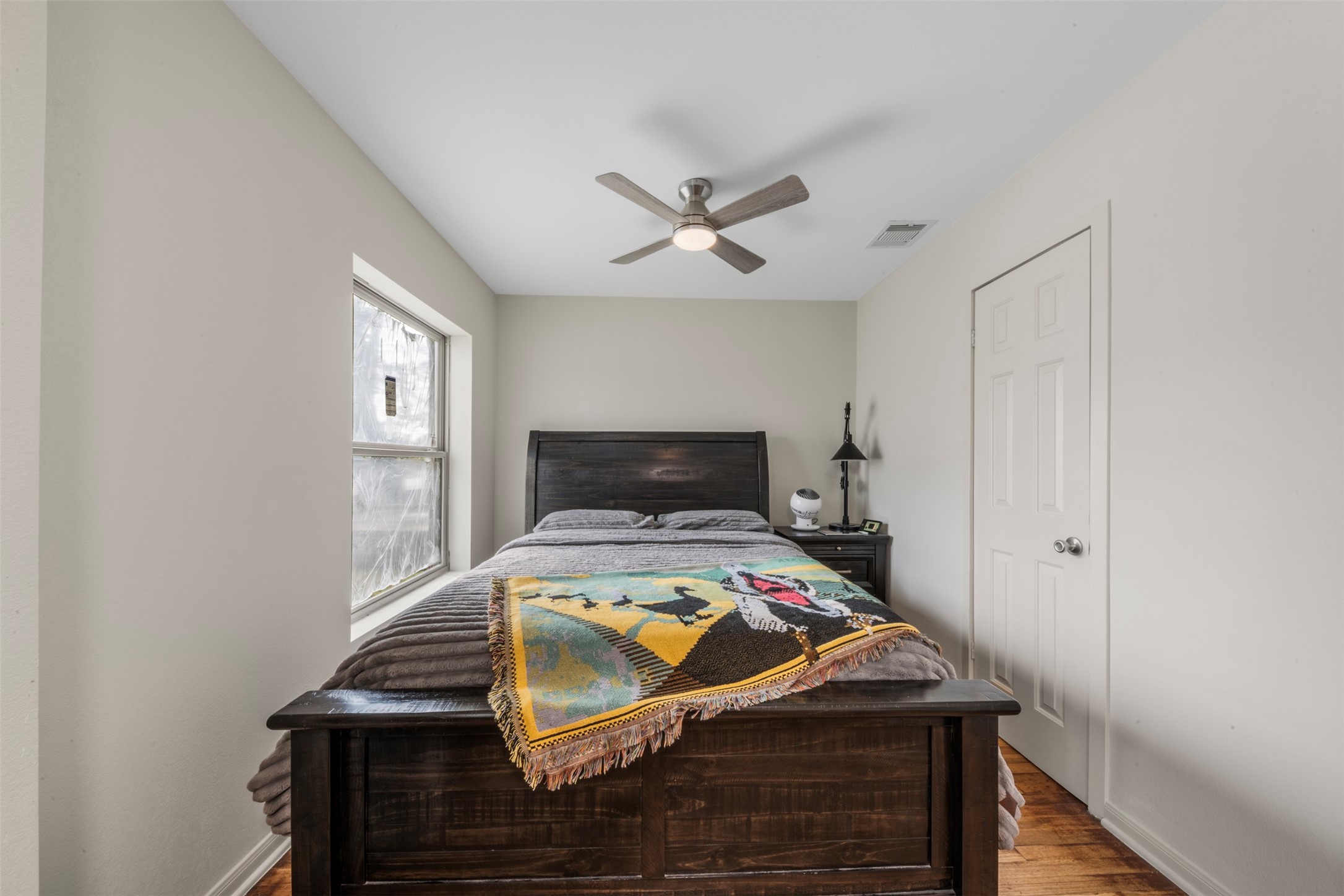 1913 Thonig Road Houston, TX 77055 - Photo 17 of 36 a bedroom with a bed and a chandelier