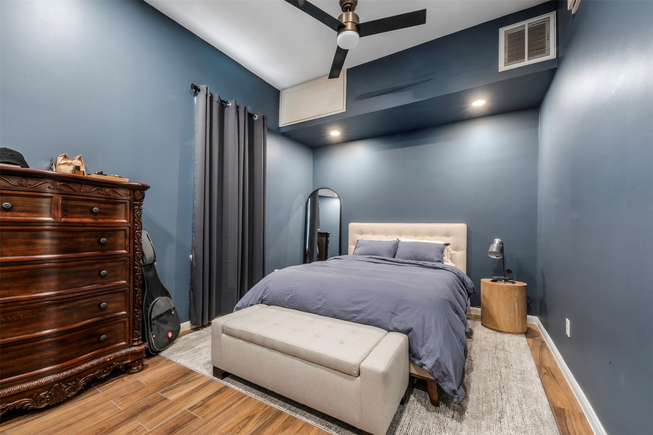 1913 Thonig Road Houston, TX 77055 - Photo 23 of 36 a bedroom with a bed and wooden floor