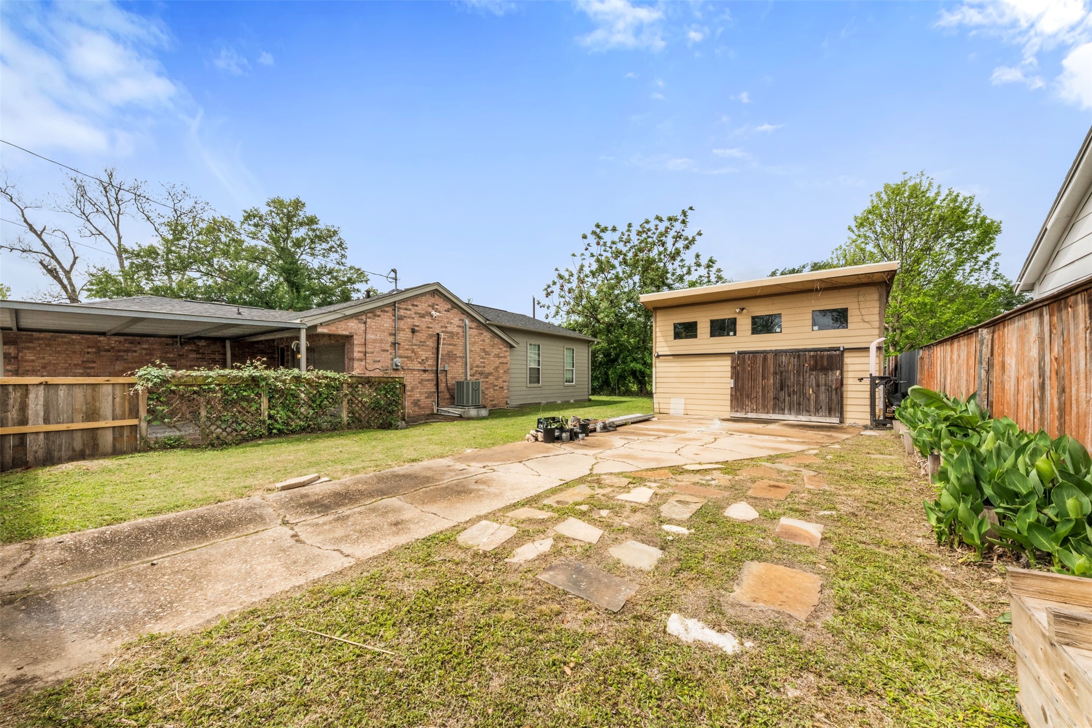 1913 Thonig Road Houston, TX 77055 - Photo 29 of 36 a front view of a house with a yard and garage