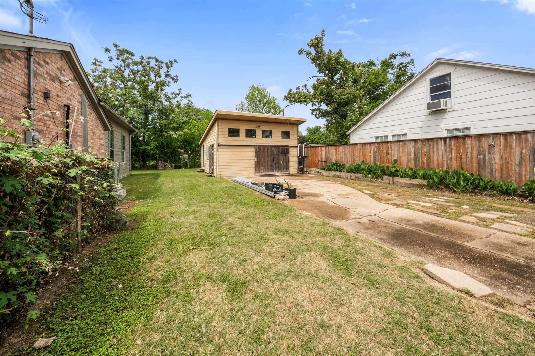 1913 Thonig Road Houston, TX 77055 - Photo 30 of 36 a view of a house with a yard and potted plants