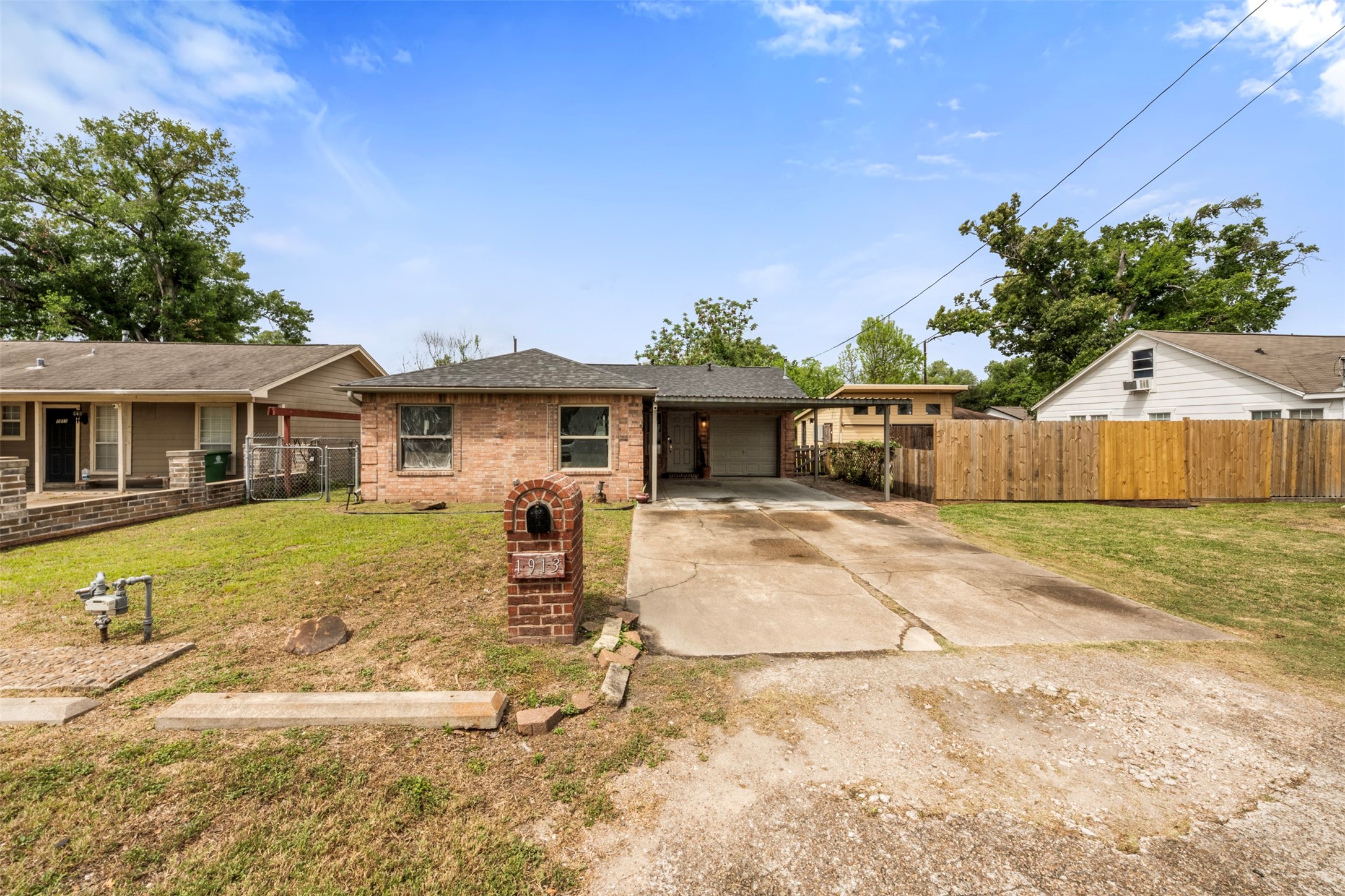 1913 Thonig Road Houston, TX 77055 - Photo 33 of 36 a front view of a house with a yard