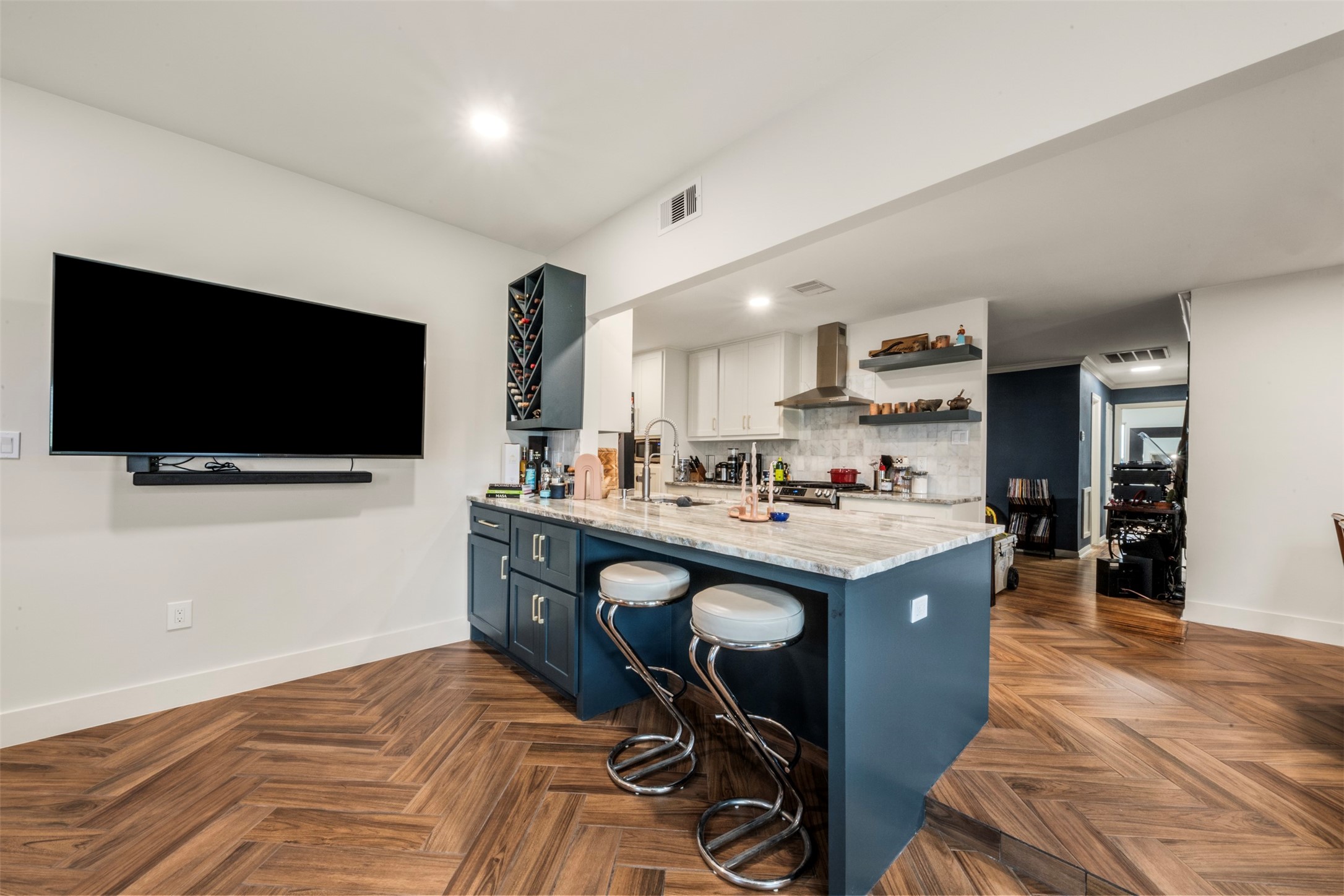 1913 Thonig Road Houston, TX 77055 - Photo 10 of 36 a view of living room with kitchen island furniture and flat screen tv
