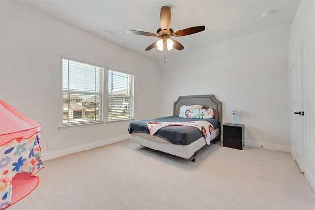 a bathroom with a double vanity sink toilet and shower