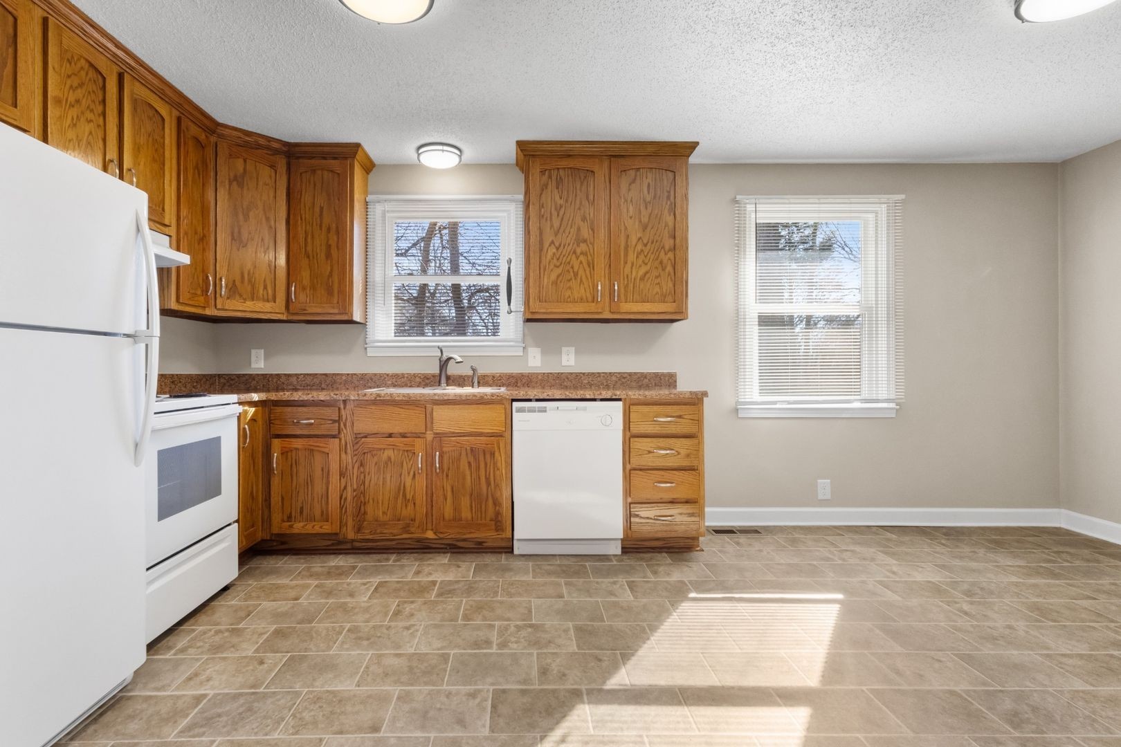 118 Union Hall Road Clarksville, TN 37040 - Photo 6 of 26 a kitchen with a stove a sink and a refrigerator