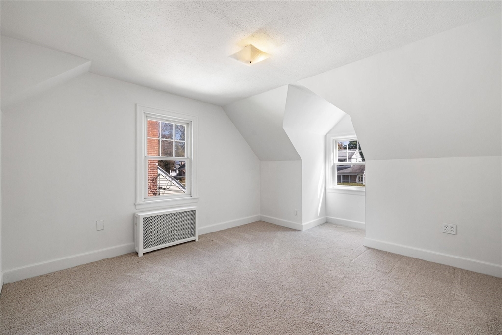 54 Ellsworth Avenue Springfield, MA 01118 - Photo 20 of 29 an empty room with windows and closet