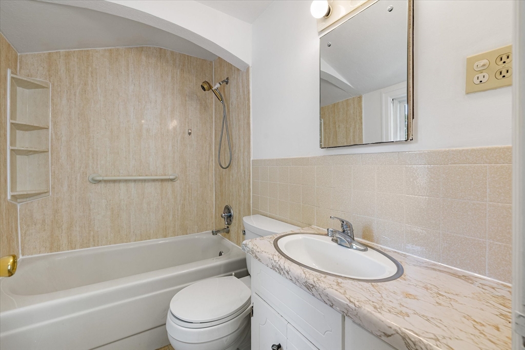 54 Ellsworth Avenue Springfield, MA 01118 - Photo 23 of 29 a bathroom with a granite countertop sink toilet and shower