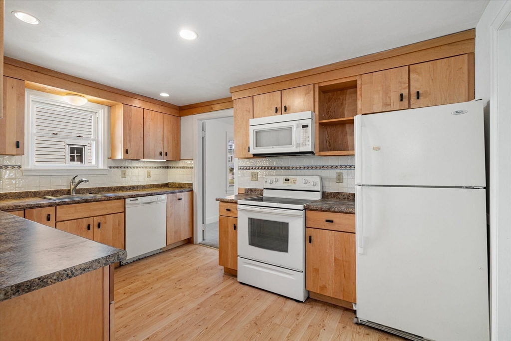 54 Ellsworth Avenue Springfield, MA 01118 - Photo 5 of 29 a kitchen with appliances a sink and a window