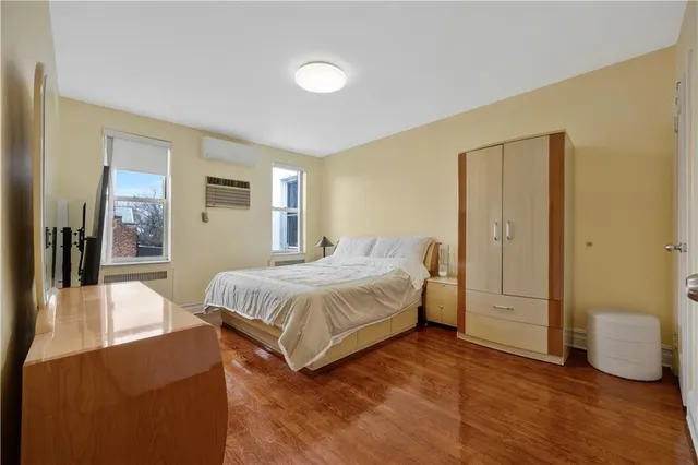 a spacious bedroom with a bed and a couch