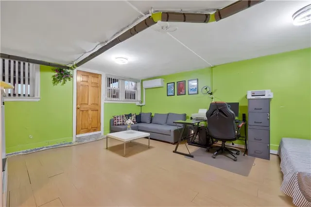 a view of a kitchen with fridge and workspace