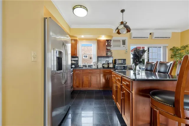 a kitchen with stainless steel appliances granite countertop a sink and cabinets