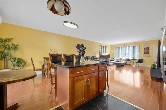 a hallway with dining table and chairs