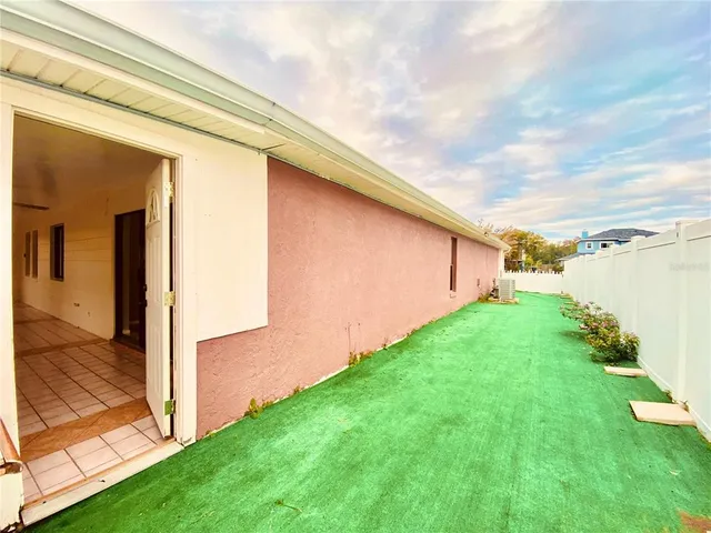 a view of a backyard with pathway