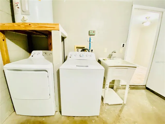 a utility room with dryer and washer