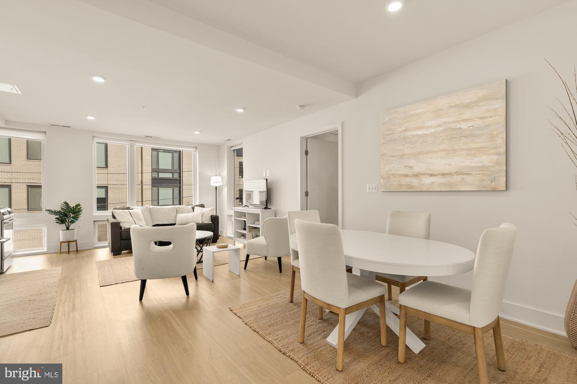 1761 P Street Northwest, Unit 202 Washington, DC 20036 - Photo 4 of 17 a living room with furniture and a table