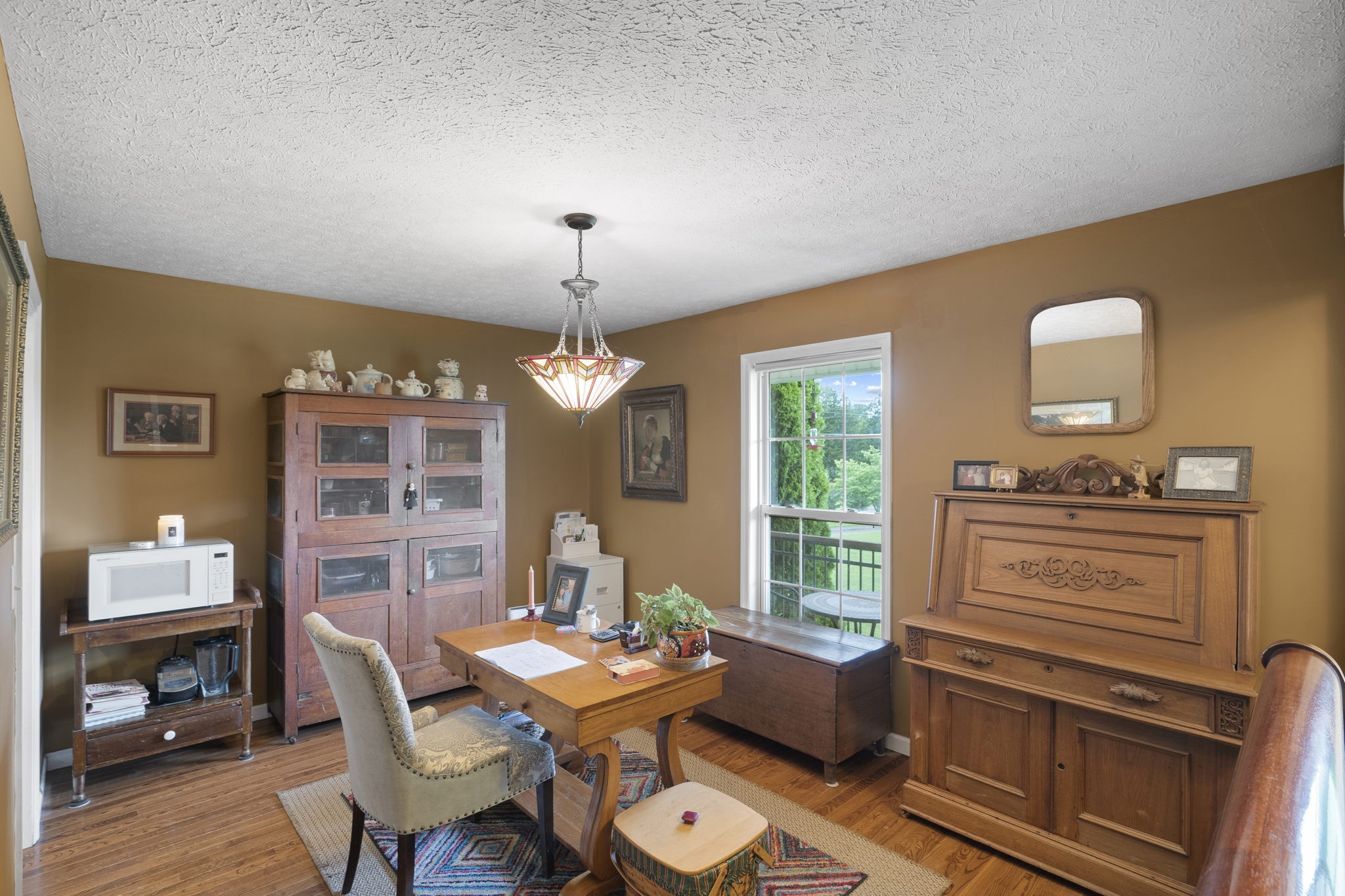 7313 West Cook Road Springfield, TN 37172 - Photo 14 of 40 a view of a dining room with furniture window and wooden floor