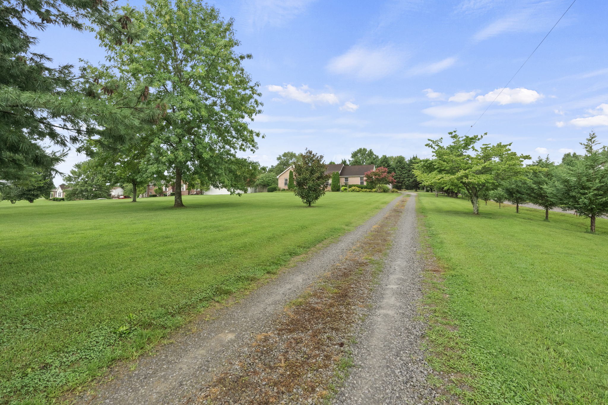 7313 West Cook Road Springfield, TN 37172 - Photo 2 of 40 a view of a golf course with a lake