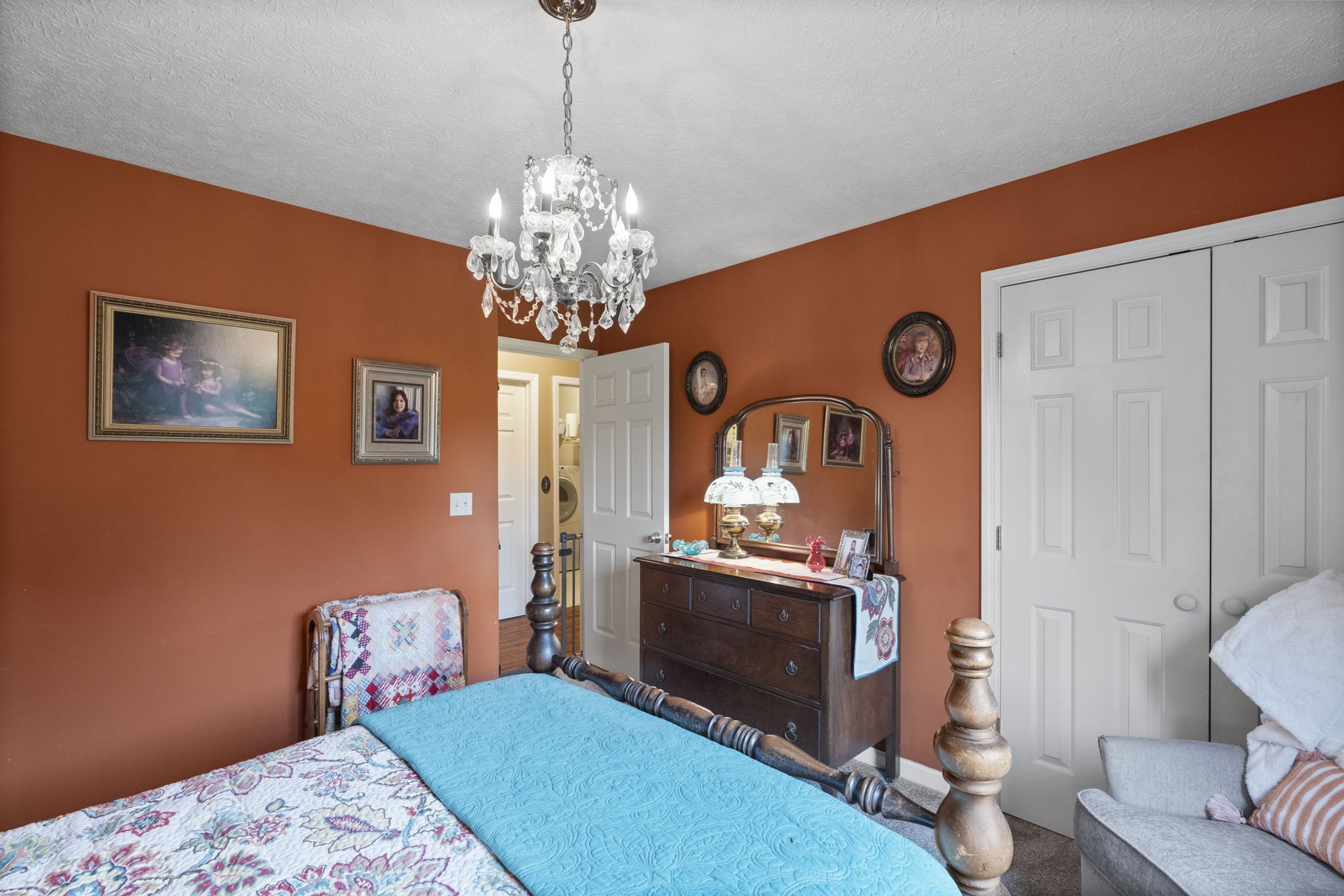 7313 West Cook Road Springfield, TN 37172 - Photo 28 of 40 a living room with furniture a chandelier and a fireplace