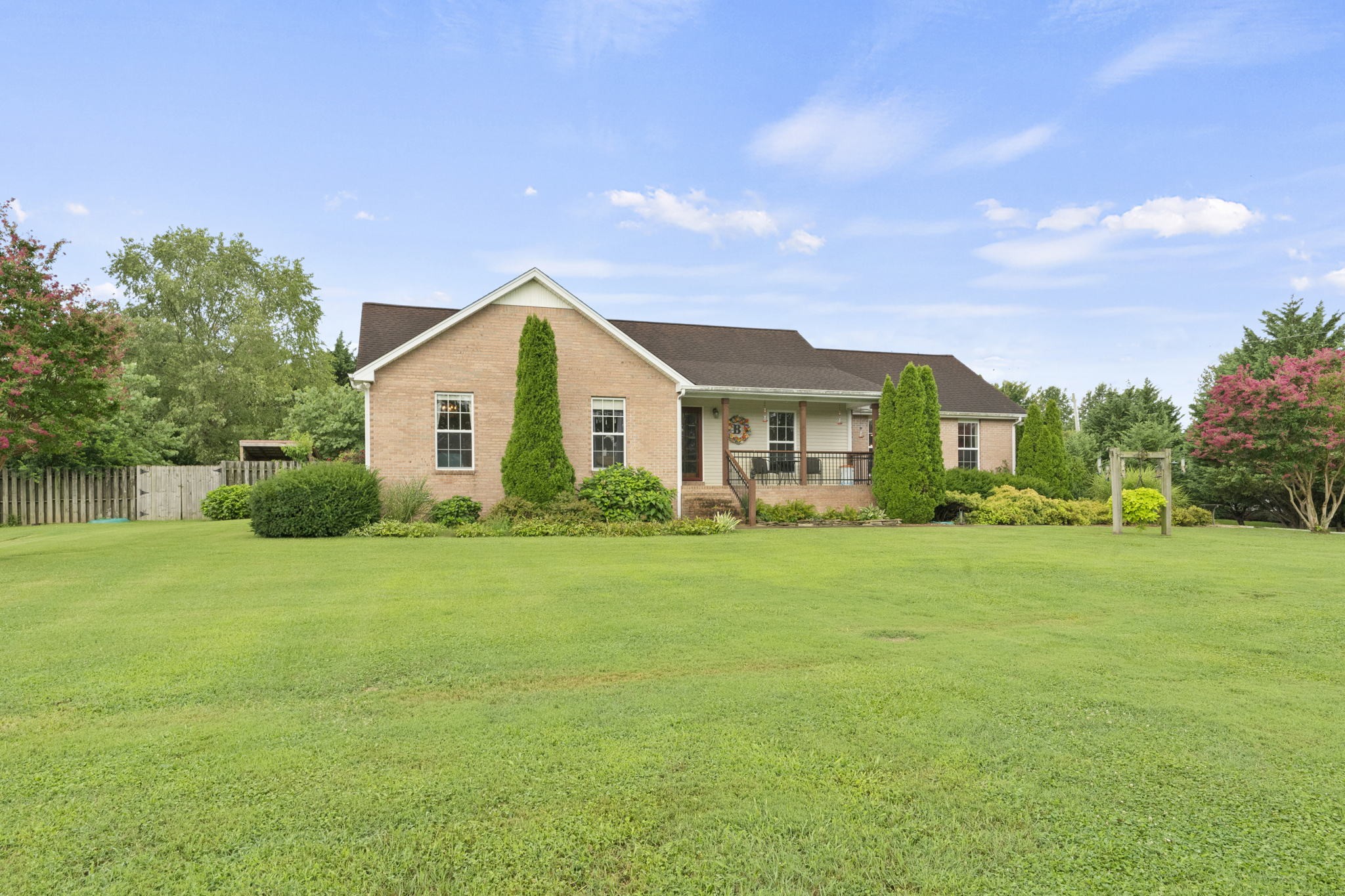 7313 West Cook Road Springfield, TN 37172 - Photo 3 of 40 a front view of a house with a yard and trees